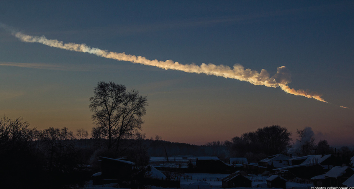 FIGURE 1. Trace of an alien visitor. An object entered the atmosphere over the Urals early in the morning of February 15, 2013. The fireball exploded above the city of Chelyabinsk, resulting in damage to buildings and injuriesto hundreds of people. This photo was taken by Alex Alishevskikh about a minute after noticing the blast. Credit: Alex Alishevskikh, courtesy European Space Agency.