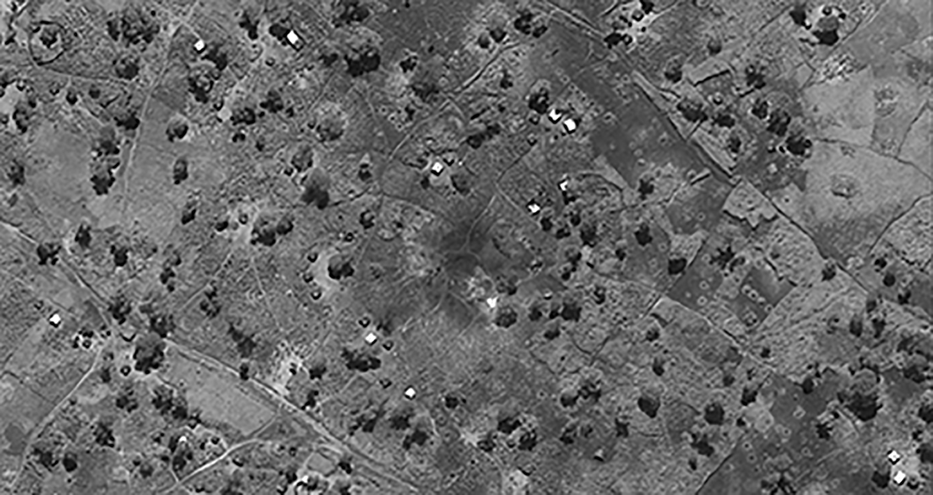 FIGURES 3-4. Evidence of airstrike outside of Jau, Unity State, South Sudan, appears in the center of the bottom image, taken Sept. 8, 2013. Before image was taken June 12, 2013. Both are courtesy of DigitalGlobe.